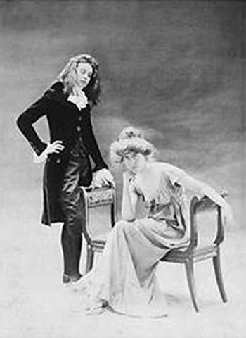 Renée Vivien (left) and Natalie Barney posing for a portrait in Directoire-era costume